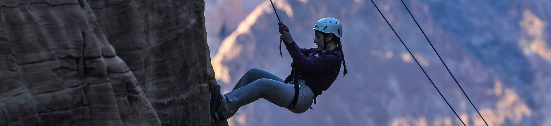 Stunning view of the AlUla Adventure Hub surrounded by desert cliffs, highlighting thrilling activities like ziplining and Via Ferrata in Saudi Arabia.