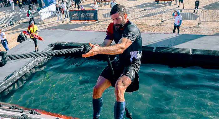 Rope Clinging Challenge Above Water at Desert Warrior Challenge - Warrior Group