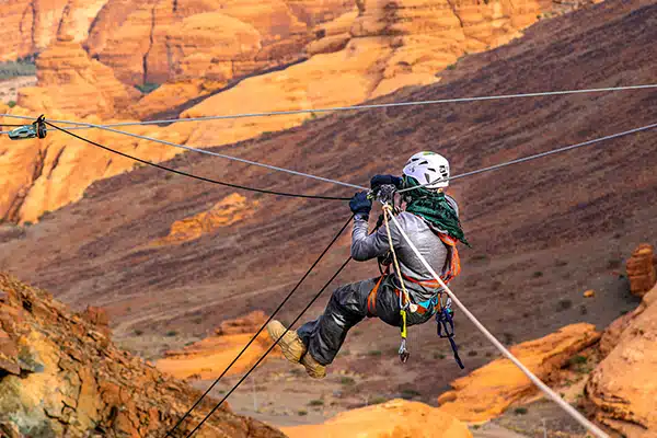 Operations team overseeing zipline activities and ensuring safe landings with advanced braking systems at an adventure park.