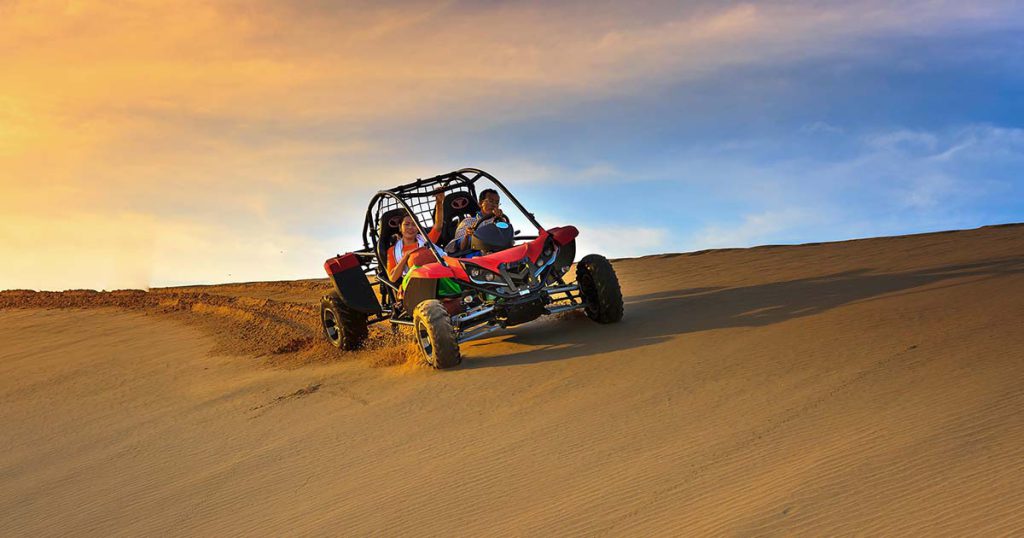 Adventure in a 4x4 buggy dunes bashing in a desert adventurously with thrill and excitement