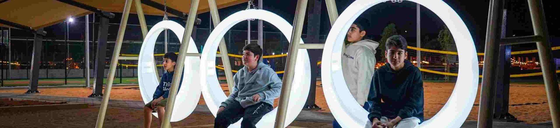 Sustainable playground designed by The Warrior Group, featuring recyclable materials and solar-powered lights for eco-friendly community spaces
