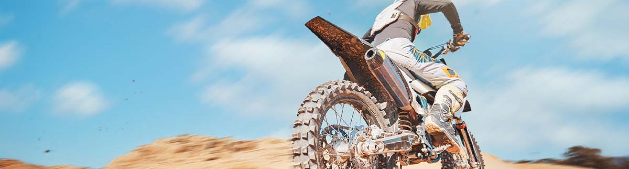 back-of-motorbike-offroad-sports-and-speed-on-blu-2023-11-27-05-02-18-utc