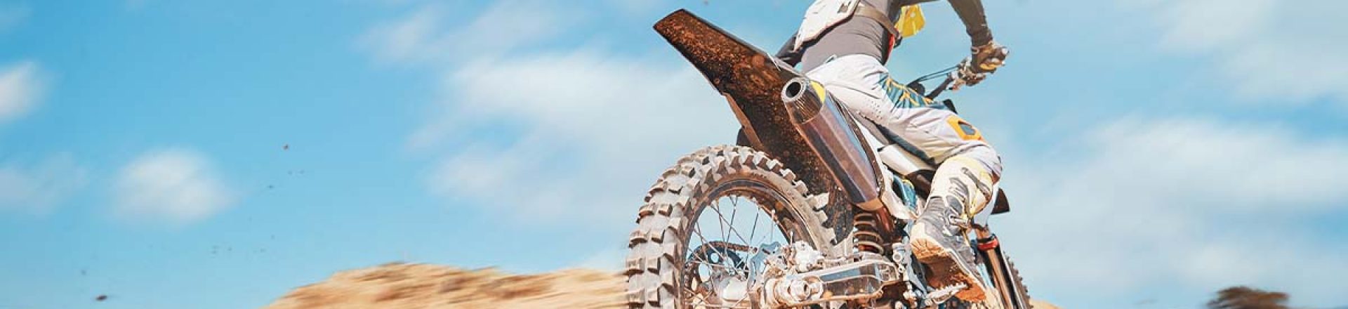 back-of-motorbike-offroad-sports-and-speed-on-blu-2023-11-27-05-02-18-utc